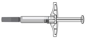 Siringa preriempita con stantuffo retratto e ago metallico protetto da cappuccio di sicurezza trasparente