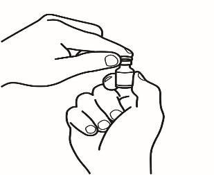 Mani che tengono e manipolano un piccolo flacone di vetro con un tappo superiore a vite