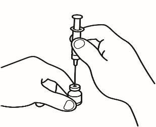 Mano che tiene una siringa pronta per l