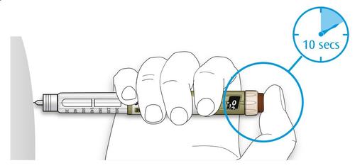 Mano che tiene un dispositivo per iniezione con indicatore temporale circolare che mostra 10 secondi