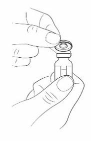 Mano che tiene un flaconcino medicinale con tappo grigio e rimuove il protettore superiore circolare