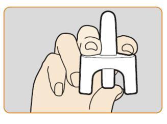 Mano che afferra un dispositivo medico bianco a forma di U con due dita e il pollice