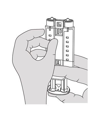 Mano che inserisce un dispositivo cilindrico con pulsanti in una base a incastro con supporto a croce