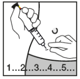 Mano che tiene una siringa pronta per l