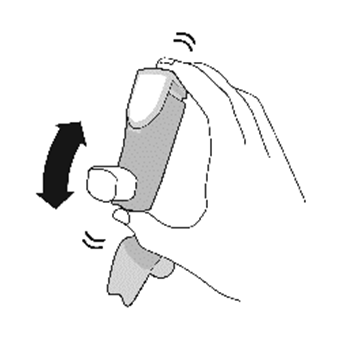 Mano che tiene un dispositivo inalatorio grigio con frecce curve nere che indicano la rotazione del meccanismo inferiore