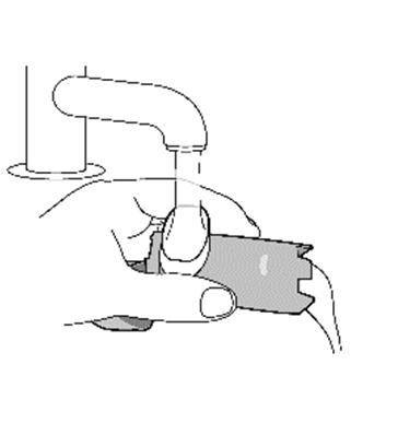 Disegno schematico di un inalatore nasale con applicatore e area di somministrazione nel naso