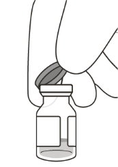Mano che afferra il tappo di un flacone di vetro trasparente contenente un liquido chiaro