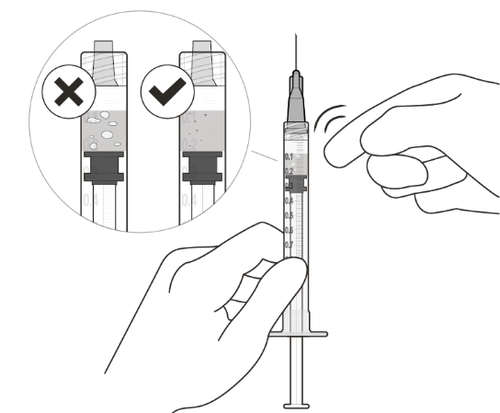 Mano che tiene una siringa con ago, due fiale una con segno di spunta e l