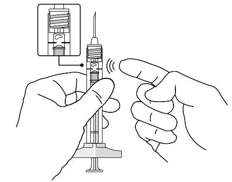 Mano che tiene una siringa preriempita con ago esposto e ingrandimento del meccanismo di sicurezza attivato