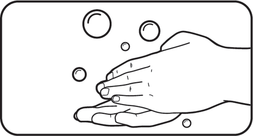 Mano aperta con bolle di sapone sospese sopra e attorno al palmo e alle dita