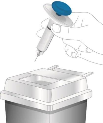 Dispositivo autoiniettante con ago esposto sopra un contenitore di smaltimento bianco e grigio