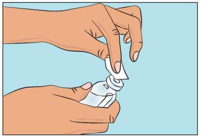 Mano che tiene un dispositivo spray nasale bianco con cappuccio protettivo, pronto per l