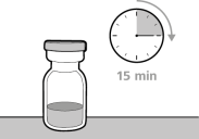 Fiala di medicinale trasparente con liquido interno e orologio che indica 15 minuti con freccia a indicare il tempo trascorso