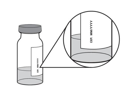 Fiala di vetro con liquido e tappo viola, dettaglio ingrandito dell