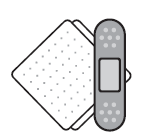 Compresse bianche con superficie punteggiata accanto a un cerotto rettangolare grigio chiaro con parte centrale bianca