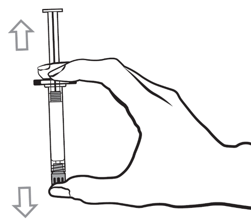 Mano che tiene una siringa con l