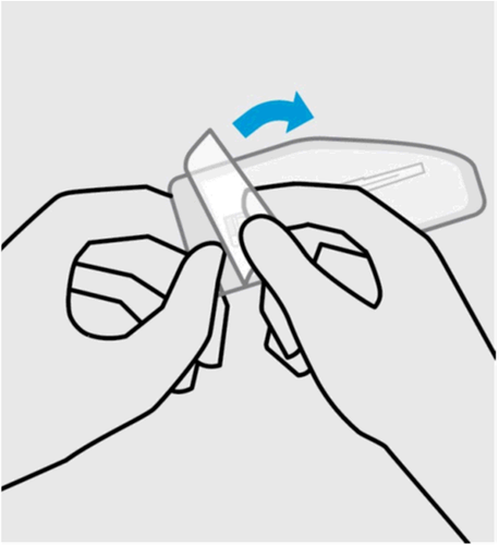 Mani che tengono e ruotano un dispositivo medico bianco con una freccia blu che indica il movimento