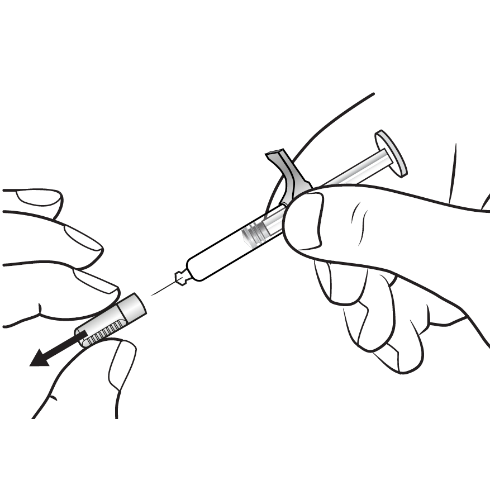 Mano che tiene una siringa pronta per l