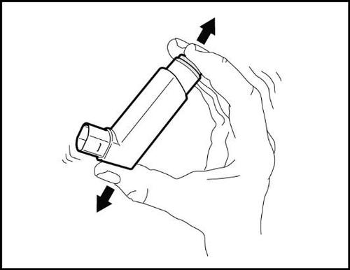 Mano che tiene un inalatore per asma con frecce nere che indicano la pressione verso il basso e l