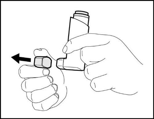 Mano che tiene un dispositivo inalatorio con una capsula da inserire indicato da una freccia nera