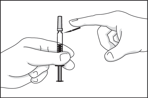 Mano che afferra una siringa preriempita mentre un