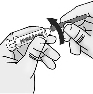 Mano che ruota un dispositivo di iniezione precompilato con una freccia nera che indica il movimento rotatorio