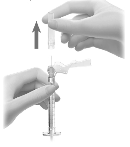 Siringa con ago e protezione, due mani che preparano l