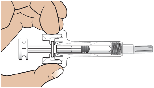 Mano che assembla un dispositivo di iniezione pre-riempito con ago trasparente e pistone nero visibile