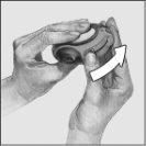 Hands holding a device auto-injector with a white arrow indicating the direction of application