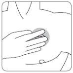 Hand applying pressure on the injection site with a needle inserted into the arm skin